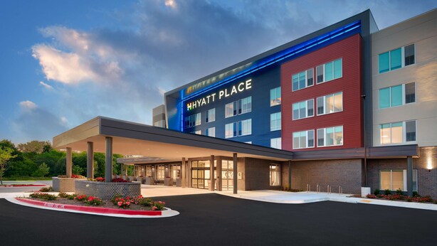 A modern hotel with a prominent sign reading "HYATT PLACE". - Hyatt Place Fayetteville/Springdale (Fayetteville)