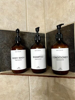 Combined shower/tub, hair dryer, towels, soap