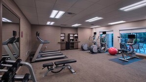 A gym with treadmills, elliptical machines, a bench, and a red exercise ball. - Residence Inn by Marriott San Marcos (San Marcos)
