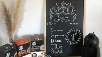 A coffee-themed display with various coffee products and a chalkboard sign listing coffee types.