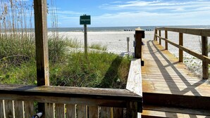 A wooden boardwalk leading to a beach with a sign reading "Seagrove". - Seagrove Villa 5B by Deserving Vacations (Isle of Palms)