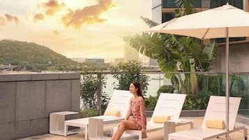 Outdoor pool, open 8:00 AM to 6:30 PM, pool umbrellas