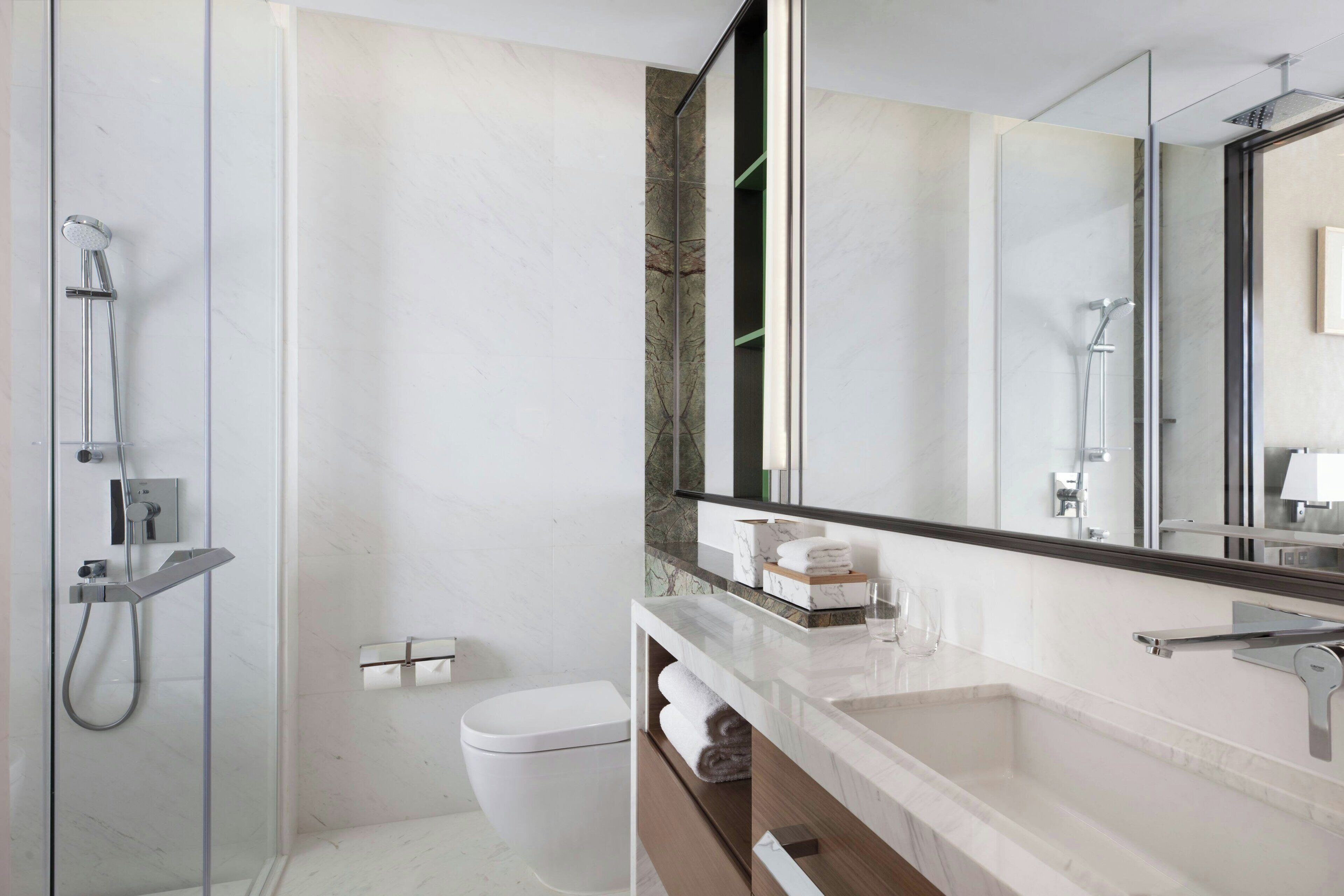 designer toiletries, hair dryer, bathrobes, slippers