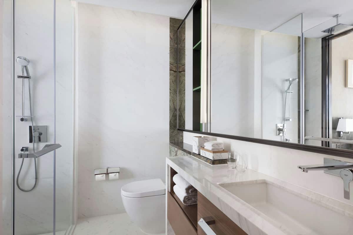 designer toiletries, hair dryer, bathrobes, slippers