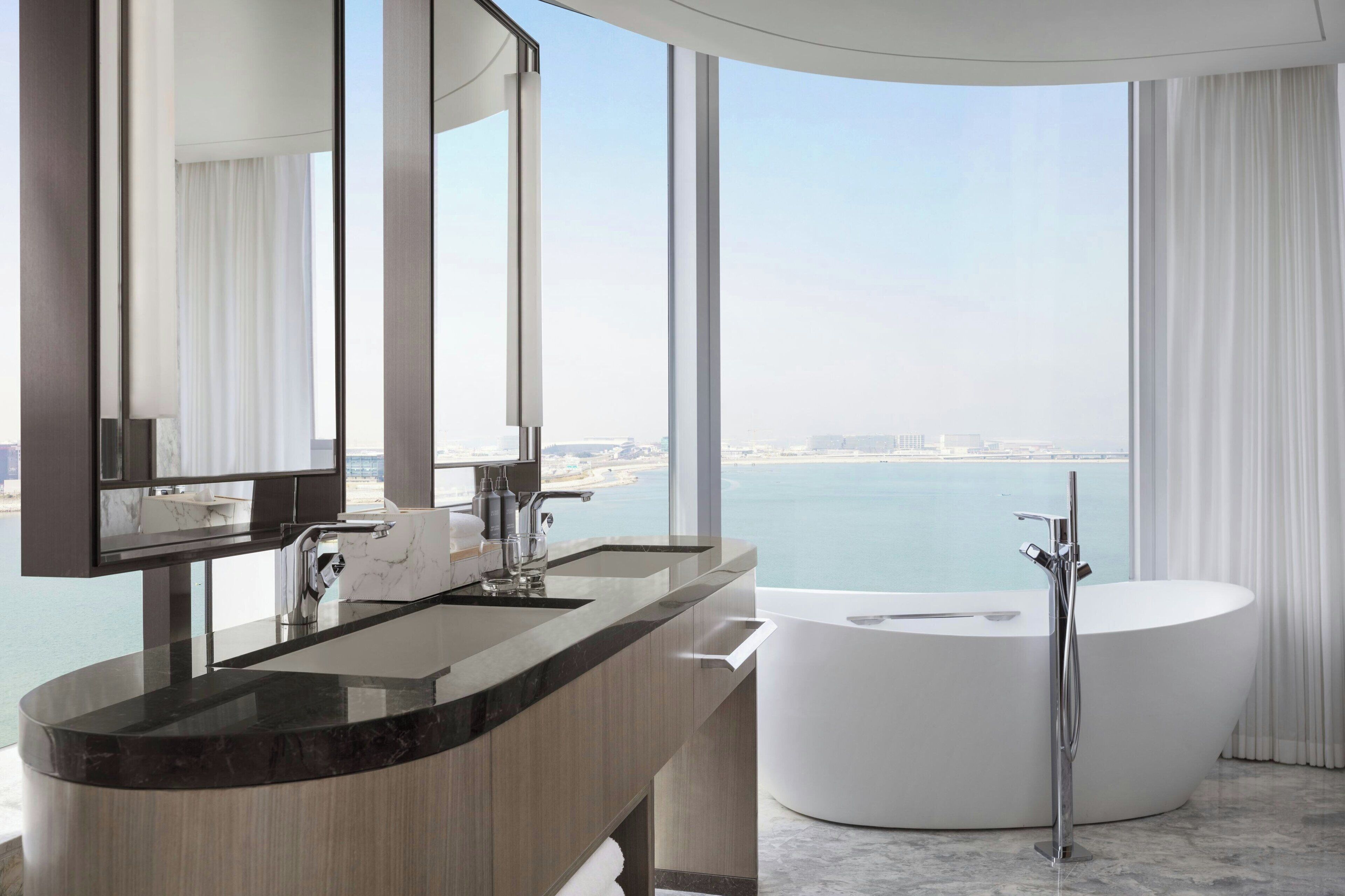 designer toiletries, hair dryer, bathrobes, slippers