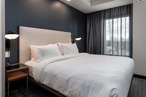 Desk, laptop workspace, iron/ironing board, cribs/infant beds