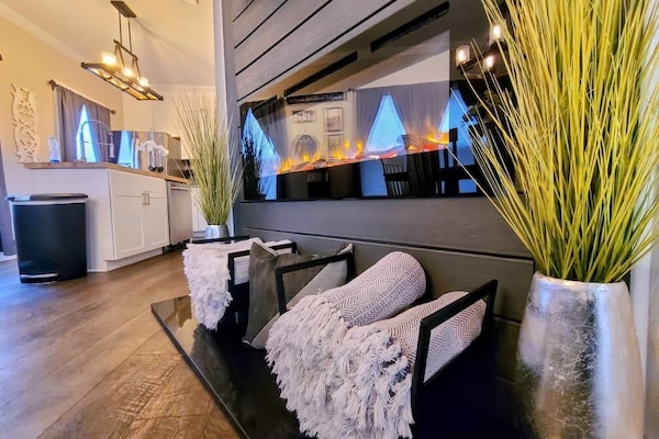 Main floor fireplace with throw blankets for winter evenings