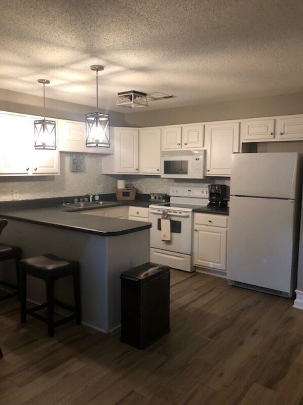 Fridge, stovetop, cookware/dishes/utensils