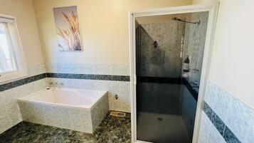 Bathtub, hair dryer, towels, soap