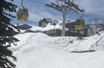 Across Big White Rd from the Gondola, Clock tower, White Crystal Inn & Bullwheel