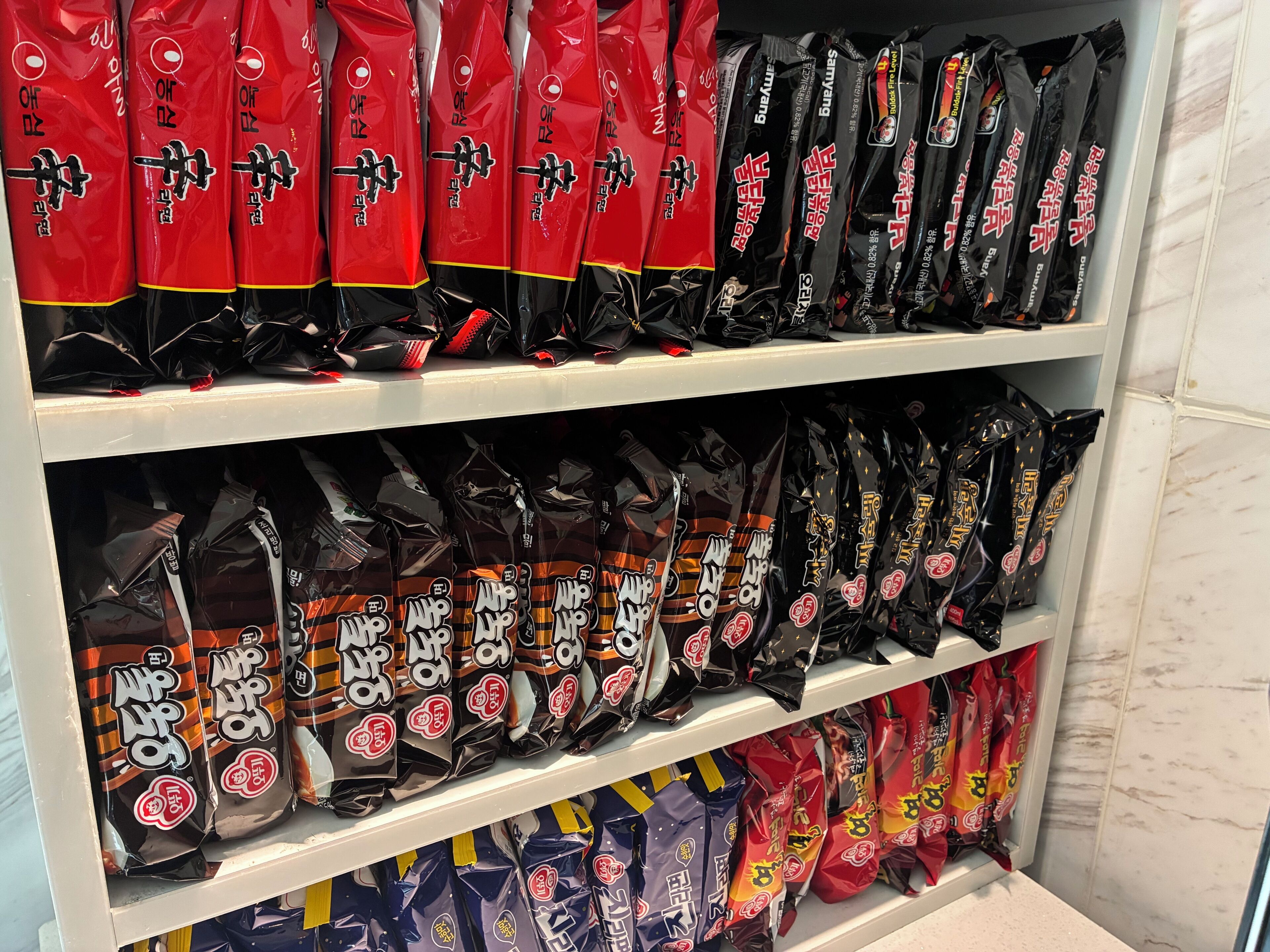 Shelves stocked with various packaged food items.