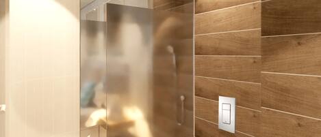 A modern bathroom with a wooden wall, a white toilet, and a glass shower enclosure.