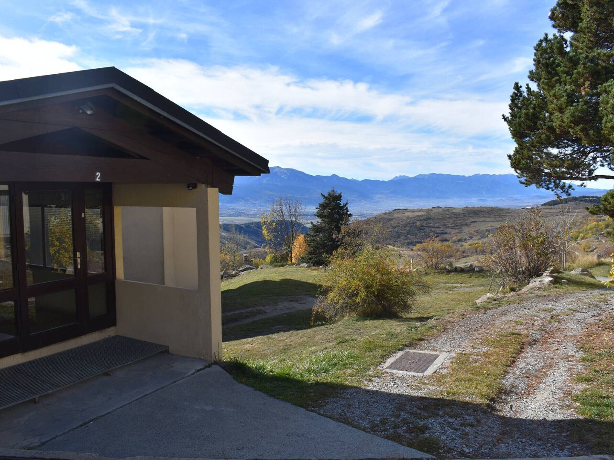 A building with a view of mountains.
