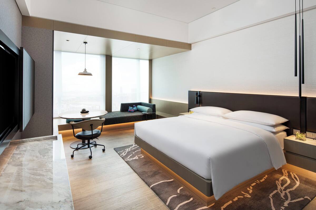 Room, 1 King Bed, City View | Minibar, in-room safe, desk, laptop workspace
