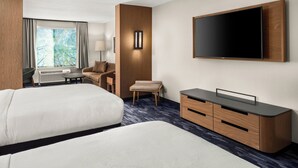 A hotel room with two beds, a TV, a desk, and a window with curtains. - Fairfield Inn & Suites by Marriott Duluth (Duluth)