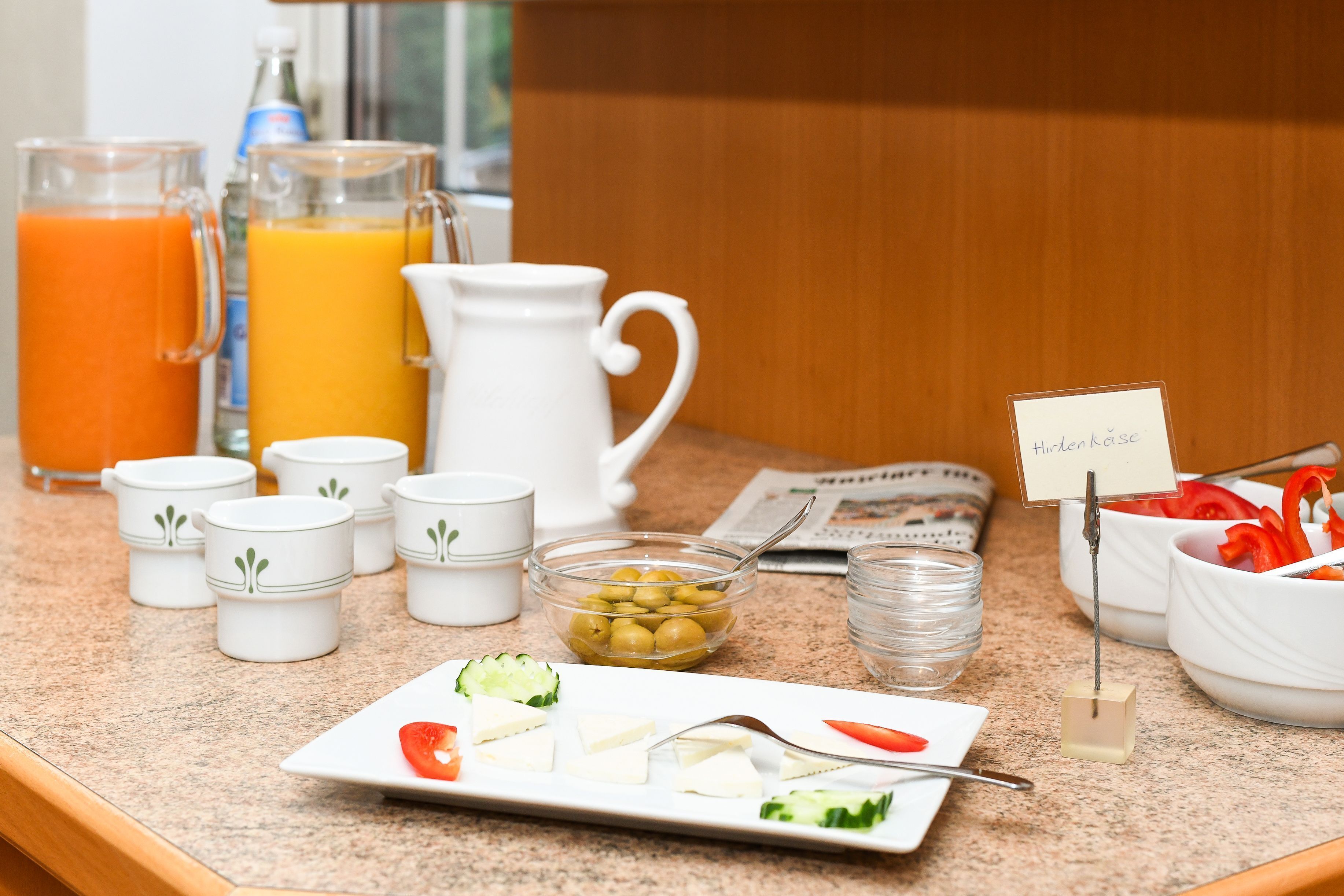 A breakfast buffet with various food items and beverages.