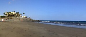 On the beach, sun-loungers