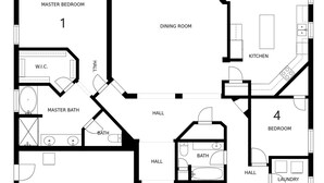 Un plan d’étage d’une maison comprenant quatre chambres, deux salles de bain, une salle à manger, une cuisine, un salon et un garage.