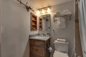 Combined shower/tub, hair dryer, towels, soap