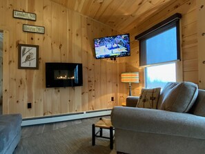 Smart TV, fireplace, table football, books