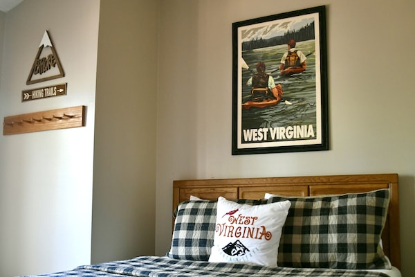 Adventure themed bedroom with queen bed