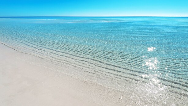 A beach with clear water and a sandy shore. - Townhome-Comm Pool-Private Beach Access 5 Min Walk (Miramar Beach)