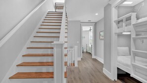 A staircase with wooden steps and white railings leading to a landing. - Townhome-Comm Pool-Private Beach Access 5 Min Walk (Miramar Beach)