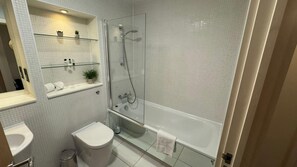 Combined shower/tub, hair dryer, towels, soap