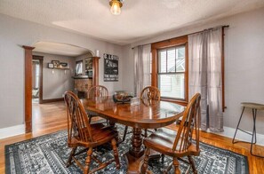 Enjoy meals in this cozy dining area with a round table and comfortable seating for four.