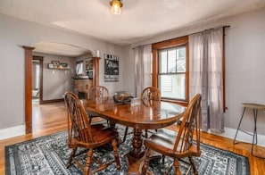 Enjoy meals in this cozy dining area with a round table and comfortable seating for four.