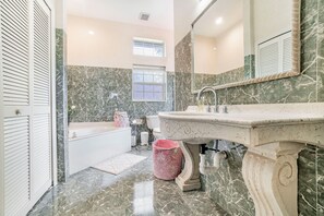 Combined shower/tub, hair dryer, towels, soap
