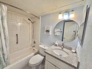 Bathtub, hair dryer, towels, soap