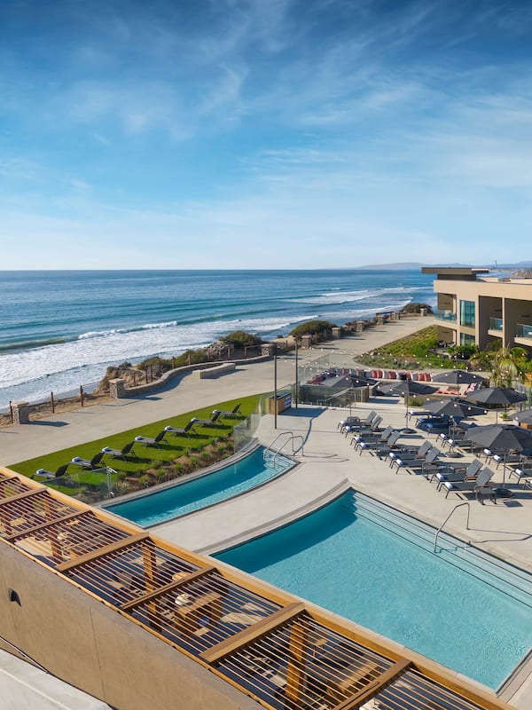 Relax by the pool surrounded by lush gardens and ocean views.