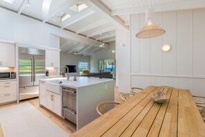 Fridge, microwave, dishwasher, toaster - Modern Beachfront Home by Tunnels Beach (Haena)