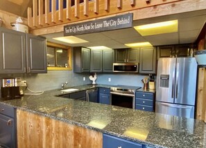 Microwave, dishwasher, coffee/tea maker, cookware/dishes/utensils