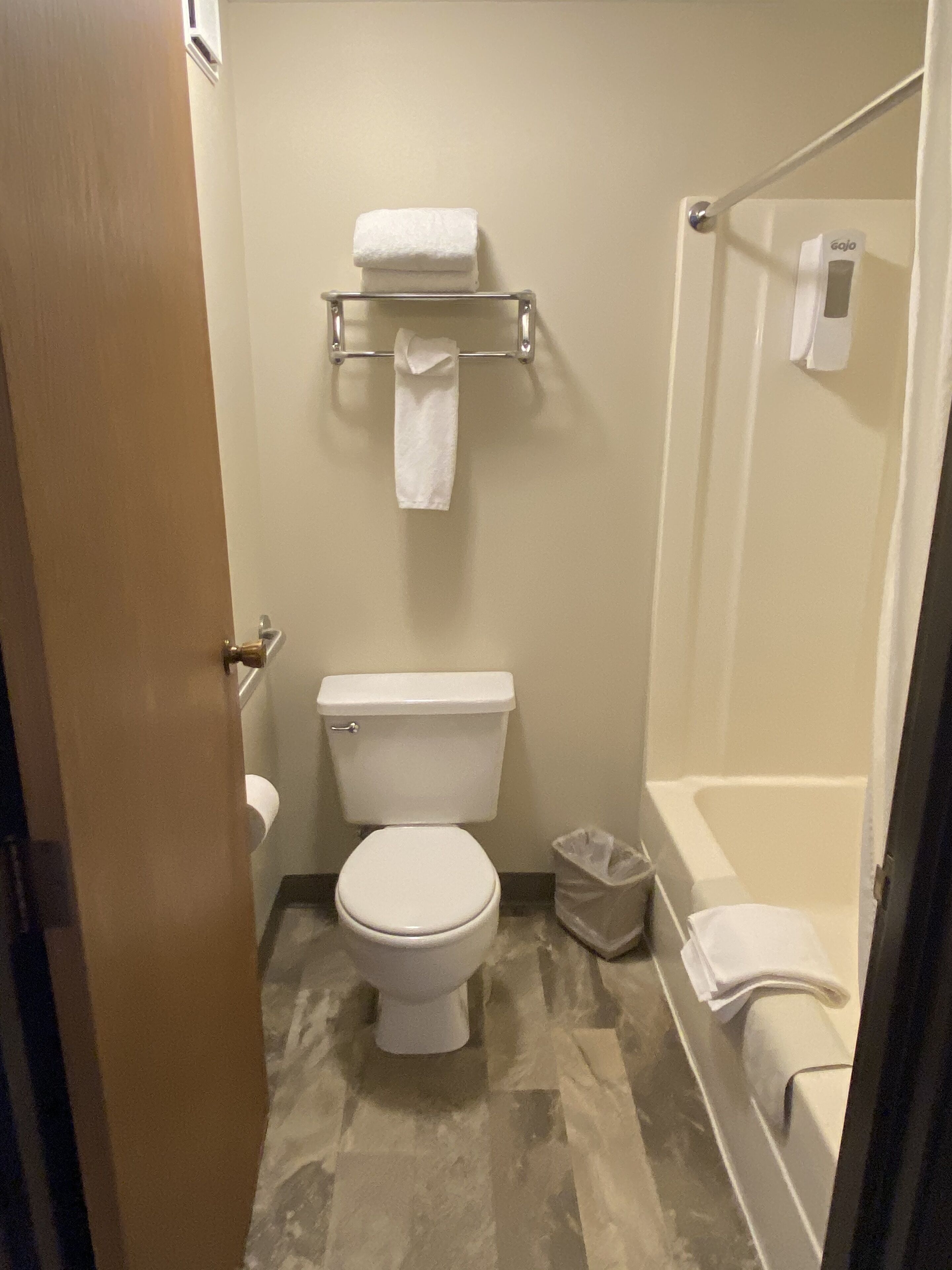 combined shower/bathtub, hair dryer, towels, soap