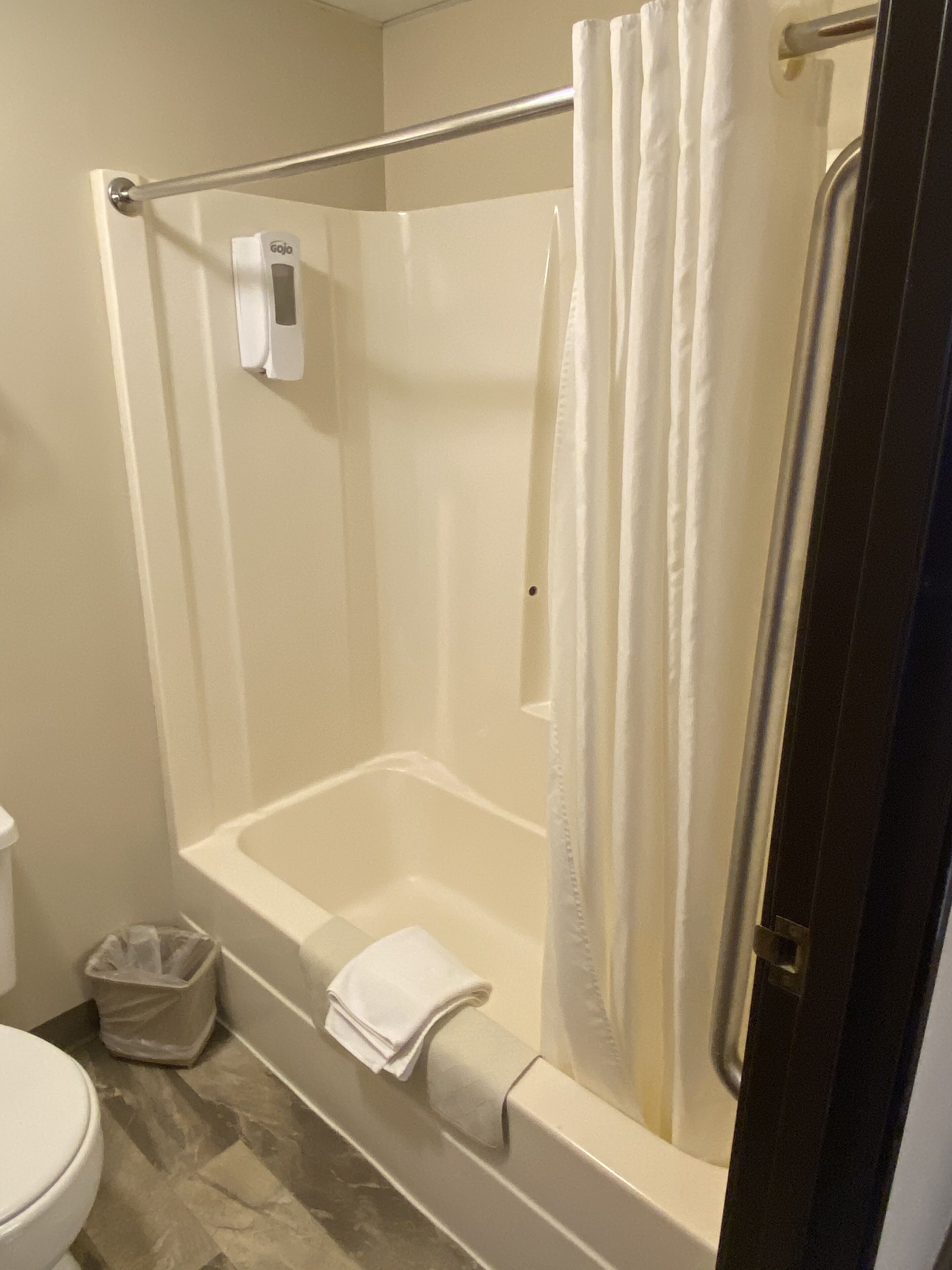 combined shower/bathtub, hair dryer, towels, soap