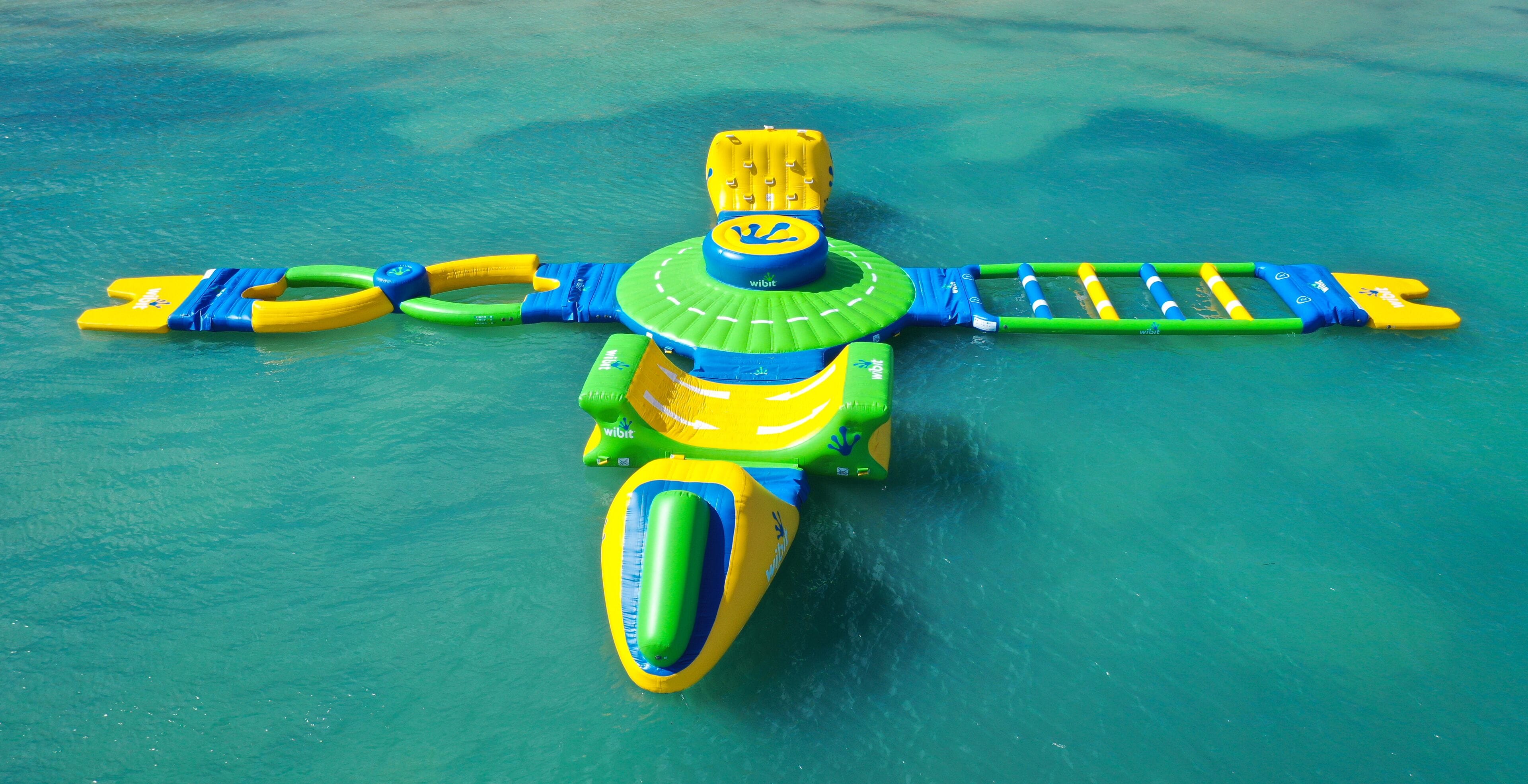 A water play structure with a slide, climbing ladder, and a platform.