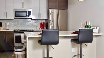 Microwave, dishwasher, coffee/tea maker, cookware/dishes/utensils