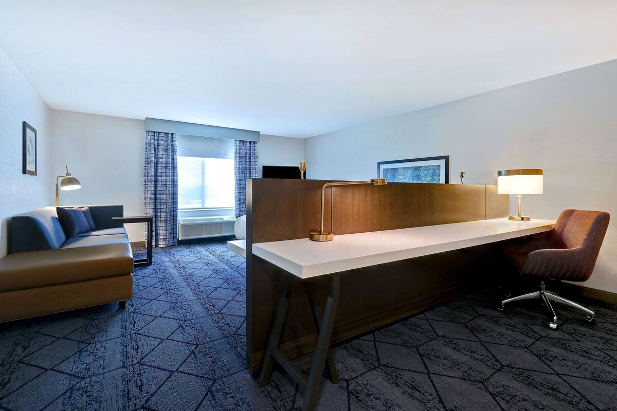 premium bedding, pillow-top beds, blackout curtains, iron/ironing board