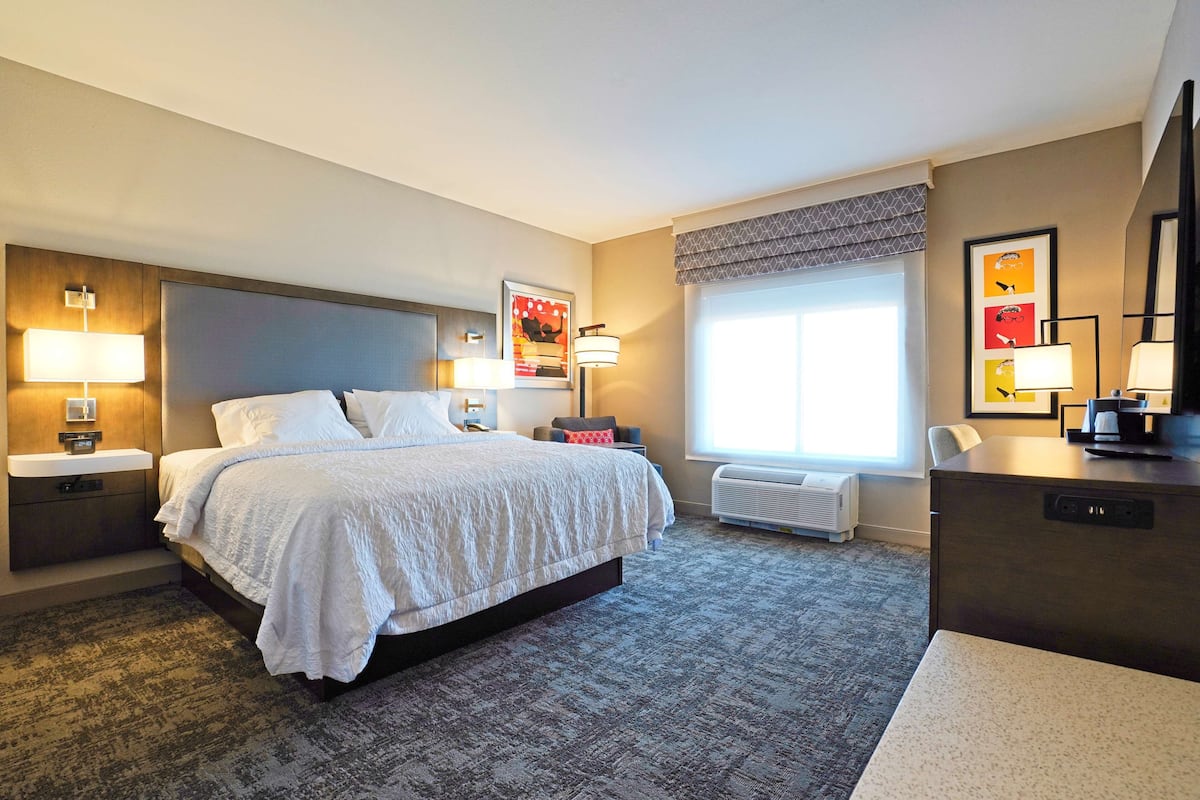 desk, laptop workspace, bed sheets