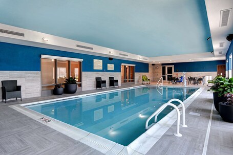 Indoor pool, open 8:00 AM to 10:00 PM, pool loungers