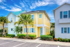 A row of colorful houses with a clear sky.