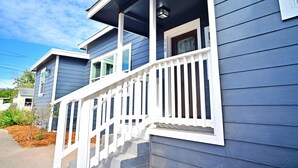 A two-story house with a white porch and a small balcony. - Family Retreat in The Village - Yard & Patio (Arroyo Grande)