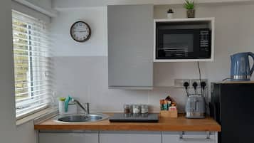 Fridge, microwave, electric kettle, toaster