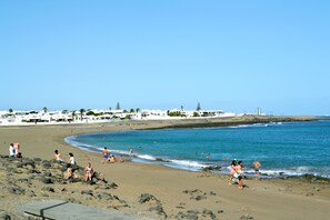 On the beach, sun-loungers