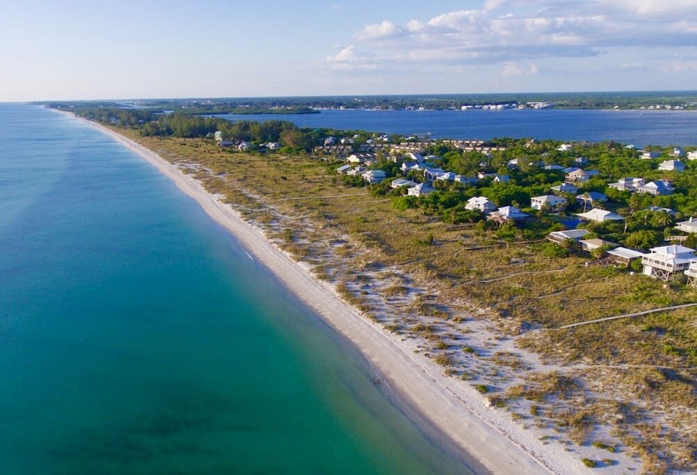 The Island: Beachfront cottage, private dock on north canal just steps away!