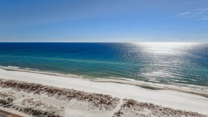 A beach with a clear sky and calm sea. - 2B Gulf Front Tower 3 20th Floor - Stunning Views! (Pensacola Beach)