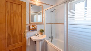 Bathtub, hair dryer, towels