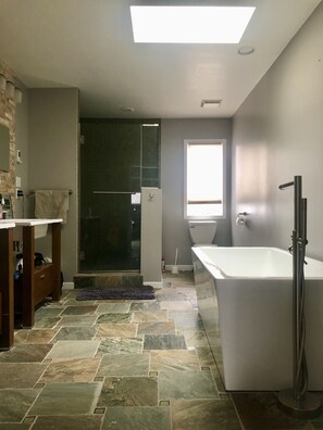 Bathtub, hair dryer, towels, soap
